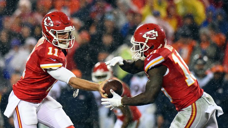 KANSAS CITY, MO - DECEMBER 25:  Quarterback Alex Smith #11 of the Kansas City Chiefs hands off to Tyreek Hill #10 during the game against the Denver Bronco