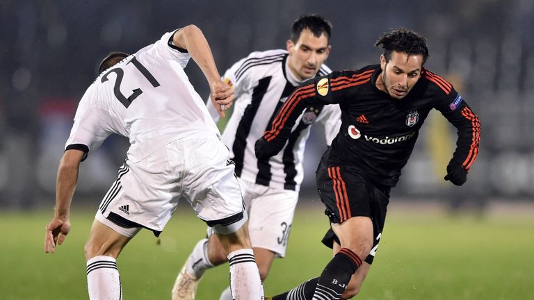 Besiktas' midfielder Kerim Frei Koyunlu (R) controls the ball in front of Partizan Belgrade's midfielder Sasa Markovic (L) and Branko Ilic (C) during the U