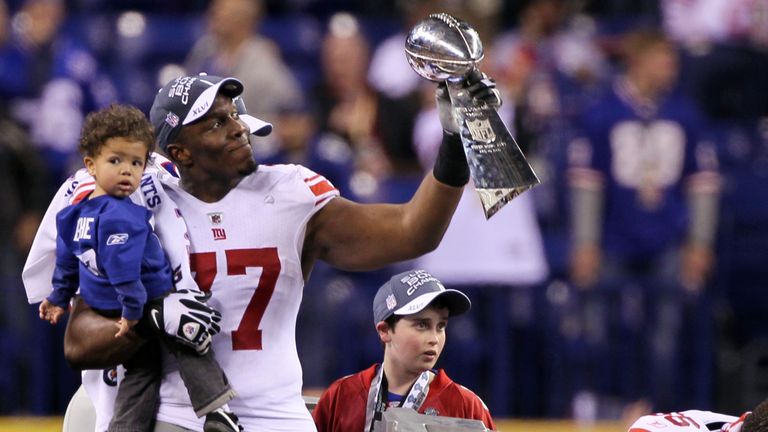 INDIANAPOLIS, IN - FEBRUARY 05:  Kevin Boothe #77 of the New York Giants poses with the Vince Lombardi Trophy after the Giants defeated the Patriots by a s