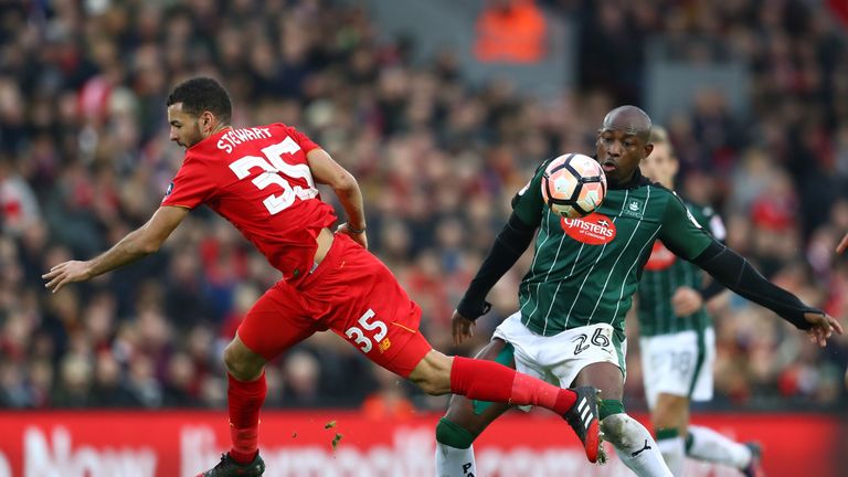 Kevin Stewart of Liverpool (L) is fouled by Arnold Garita 