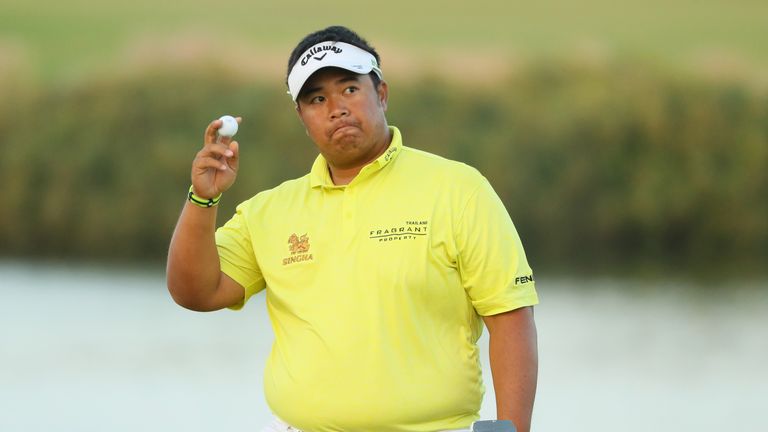 DOHA, QATAR - JANUARY 27:  Kiradech Aphibarnrat of Thailand acknowledges the crowd after holing out on the 18th green during the second round of the Commer