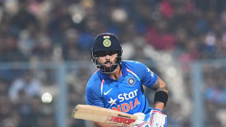 India's captain Virat Kohli plays a shot during the third One Day International match between India and England at the Eden Gardens Cricket Stadium in Kolk