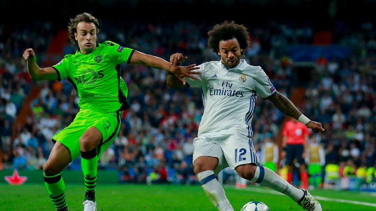 Marcelo (R) of Real Madrid CF competes for the ball with Lazar Markovic (L) of Sporting Lisbon