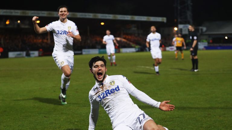 Alex Mowatt of Leeds United (front) celebrates after scoring against Cambridge
