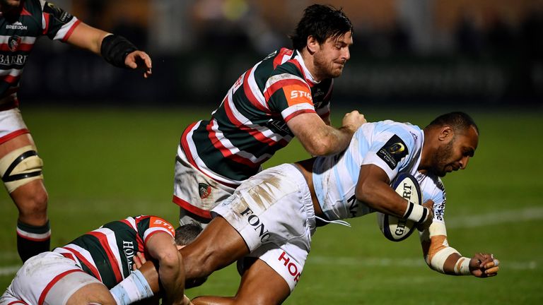 Leicester's fly-half from England Matt Smith (C) and Leicester's wing Tom Brady (down) vie with Racing-Metro's winger Joe Rokocoko (R) during the European 