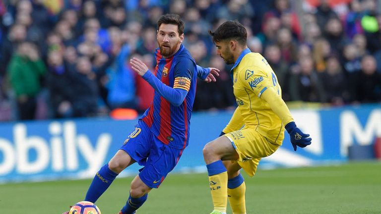 Lionel Messi dribbles with the ball