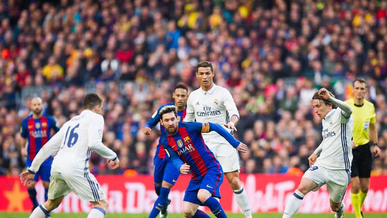 Lionel Messi looks to dribble past Mateo Kovacic, Cristiano Ronaldoand Luka Modric