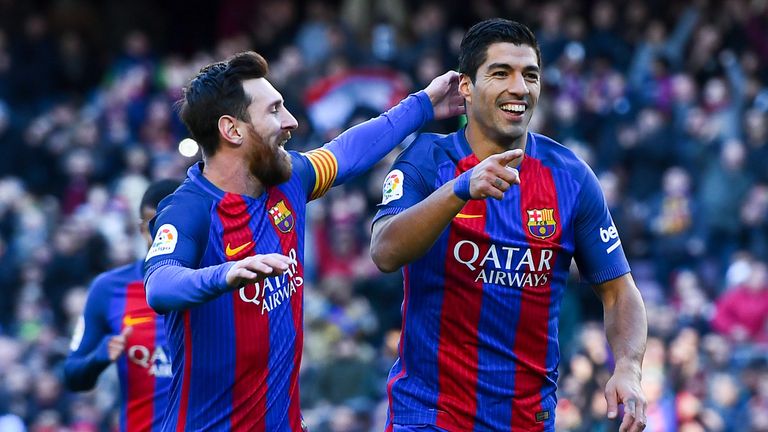 Lionel Messi (L) and Luis Suarez celebrate Barcelona's opening goal