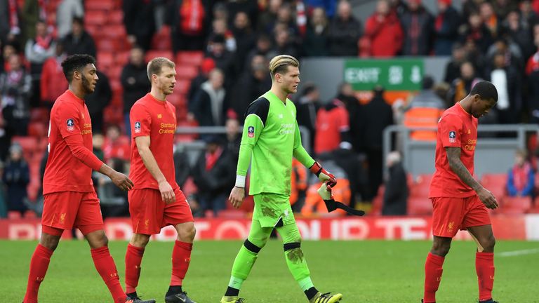 Liverpool's German goalkeeper Loris Karius (2R) leave the pitch following the English FA Cup fourth round football match between Liverpool and Wolverhampto