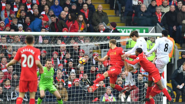 Swansea City's Spanish striker Fernando Llorente (3R) rises high to head the ball and score their second goal during the English Premier League football ma