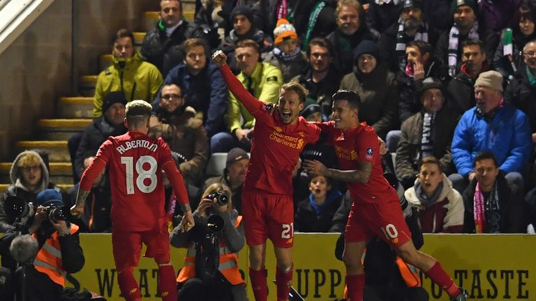 Liverpool's Brazilian midfielder Lucas Leiva (C) celebrates with teammates after scoring the opening goal of the English FA Cup third round replay football