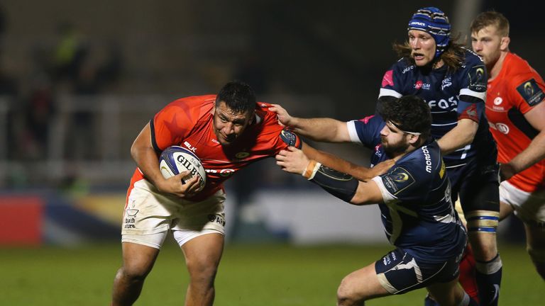 SALFORD, ENGLAND - DECEMBER 18:  Mako Vunipola of Saracens is tackled by Rob Webber of Sale Sharks during the European Rugby Champions Cup match between Sa