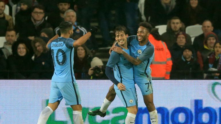 Manchester City's David Silva (centre) celebrates scoring his side's third goal of the game during the Emirates FA Cup, Third Round match at the London Sta