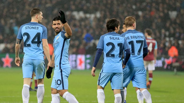 Manchester City's Sergio Aguero (second left) celebrates scoring his side's fourth goal of the game during the Emirates FA Cup, Third Round match at the Lo