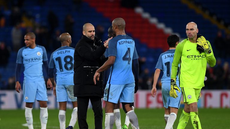 LONDON, ENGLAND - JANUARY 28: Josep Guardiola, Manager oaf Manchester City and Vincent Kompany of 