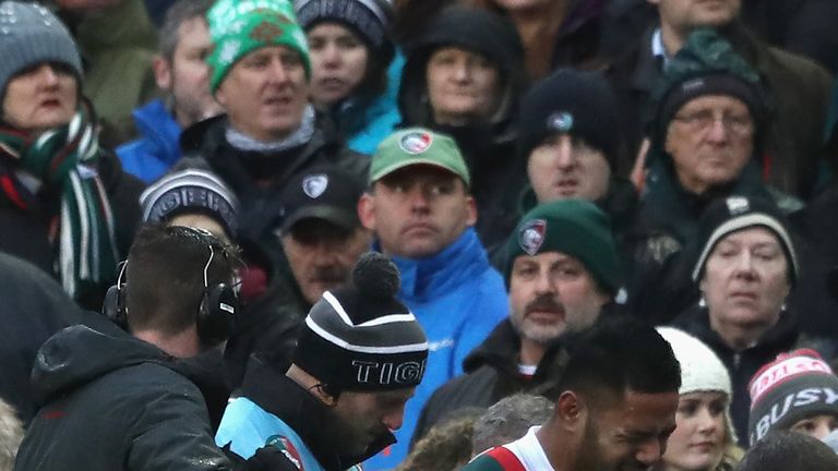 Manu Tuilagi of Leicester limps off the pitch after being injured during the match with Saracens