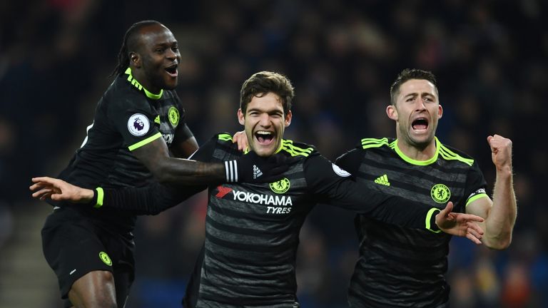 Marcos Alonso (C) celebrates with Victor Moses (L) and Gary Cahill (R)