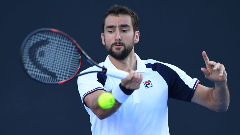 MELBOURNE, AUSTRALIA - JANUARY 18:  Marin Cilic of Croatia plays a forehand in his second round match against Daniel Evans of Great Britain on day three of