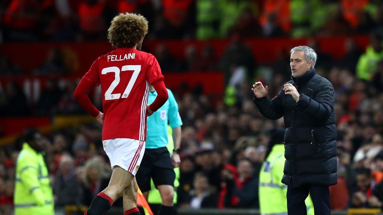 MANCHESTER, ENGLAND - JANUARY 10:  Marouane Fellaini of Manchester United celebrates with Jose Mourinho, Manager of Manchester United after scoring his sid