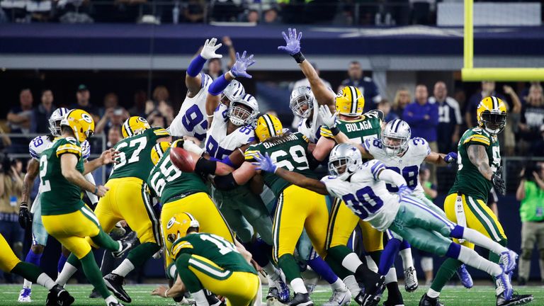 ARLINGTON, TX - JANUARY 15:  Mason Crosby #2 of the Green Bay Packers kicks a field goal to beat the Dallas Cowboys 34-31 in the NFC Divisional Playoff Gam
