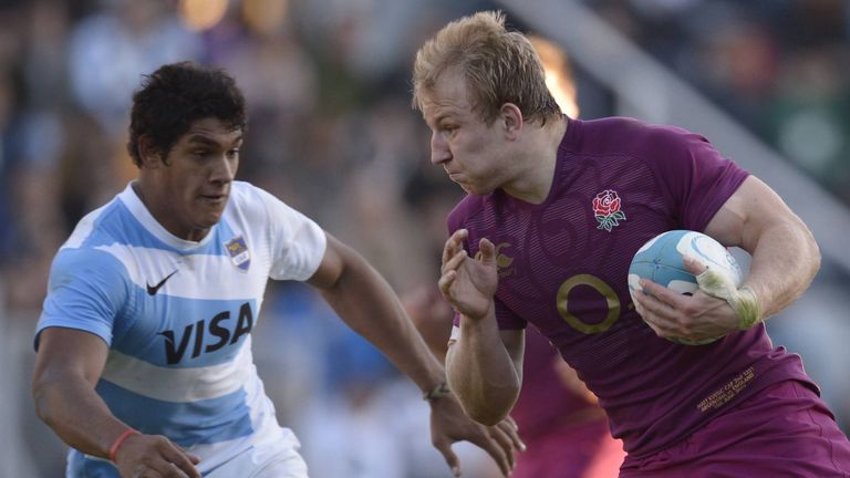 England's flanker Matt Kvesic runs through a tackle by Argentina's Los Pumas wing Manuel Montero during their rugby union international test match at Jose 