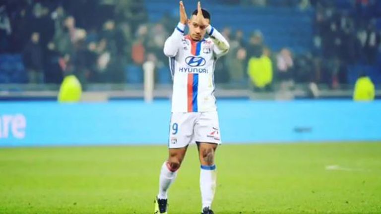 Memphis Depay applauds supporters after making his debut in Lyon's victory over Marseille.
