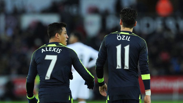Alexis Sanchez with Mesut Ozil during the Premier League match between Swansea City and Arsenal at Liberty Stadium