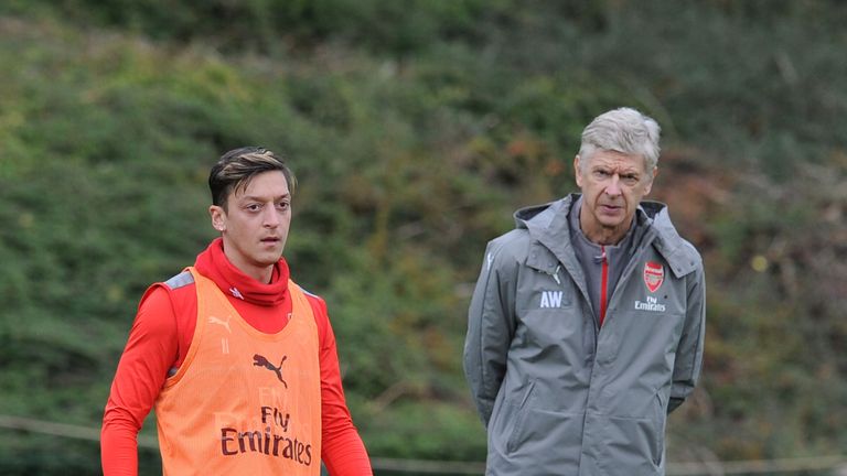 Mesut Ozil and Arsene Wenger during Arsenal training