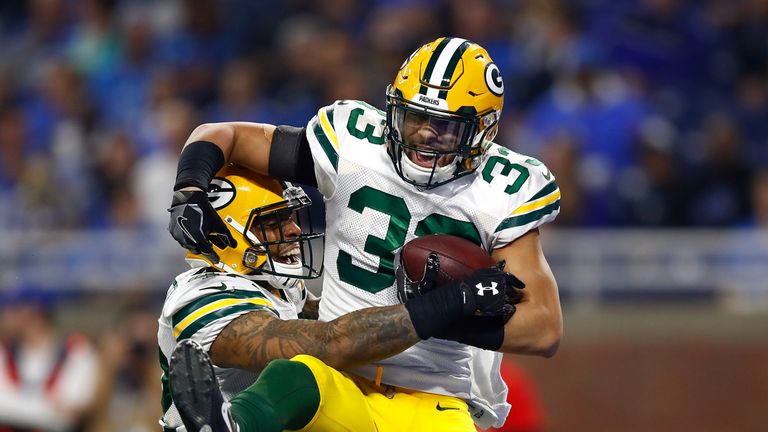 DETROIT, MI - JANUARY 1: Micah Hyde #33 of the Green Bay Packers celebrates his fourth quarter touchdown interception with Morgan Burnett #42 while playing