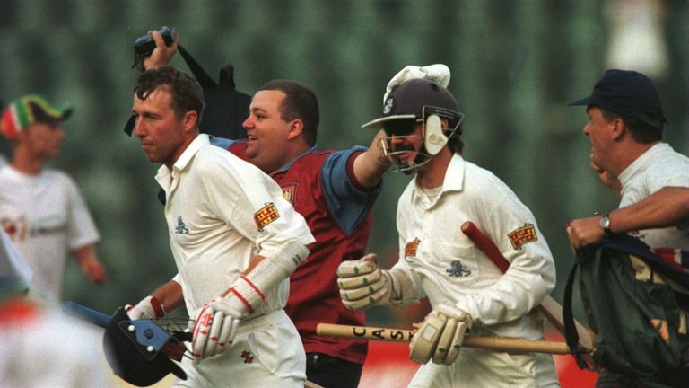 4 DEC 1995; MICHAEL ATHERTON OF ENGLAND AND JACK RUSSELL LEAVE THE FIELD AFTER DRAWING THE SECOND TEST . SOUTH AFRICA V ENGLAND,SECOND TEST AT THE WANDERER