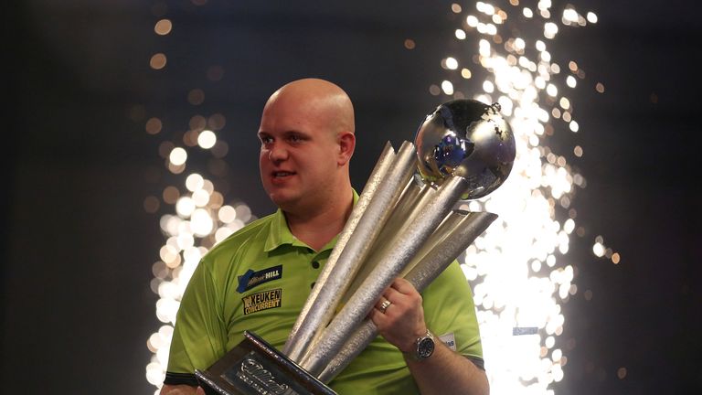 Michael van Gerwen celebrates winning with Sid Waddell trophy during day fifteen of the William Hill World Darts Championship at Alexandra Palace, London.