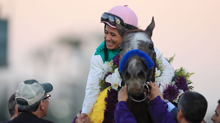 Mike Smith riding Arrogate celebrates