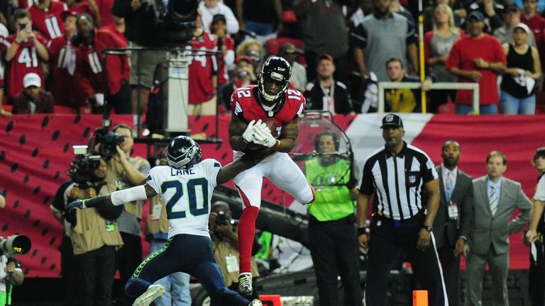 ATLANTA, GA - JANUARY 14:   Mohamed Sanu #12 of the Atlanta Falcons catches a touchdown against the Seattle Seahawks at the Georgia Dome on January 14, 201