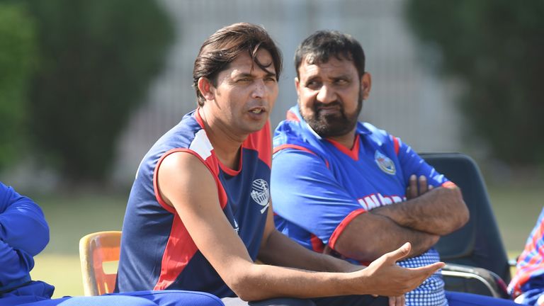 Former Pakistan cricketer Mohammad Asif (C) looks on during a domestic one-day match in Hyderabad on January 10, 2016. Butt and Mohammad Asif returned to d
