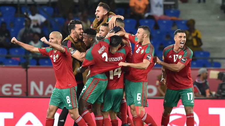 Morocco's players celebrate after scoring a goal during the 2017 Africa Cup of Nations group C football match between Morocco and Ivory Coast in Oyem on Ja