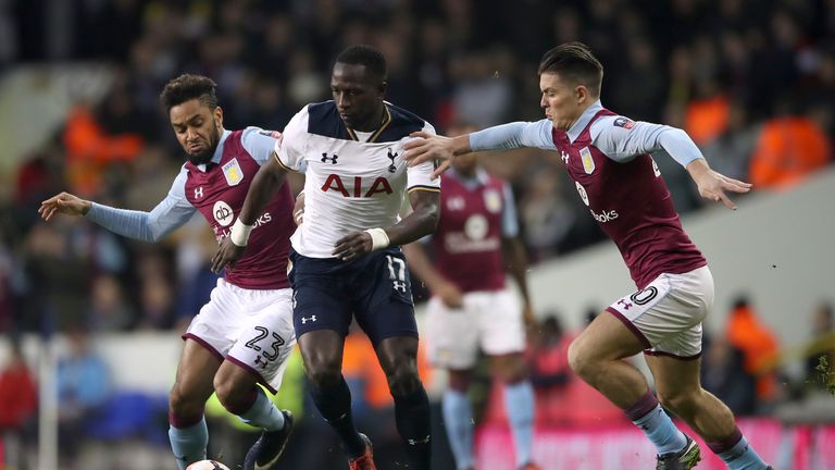 Moussa Sissoko (C) battles for the ball with Jordan Amavi (L) and Jack Grealish (R)