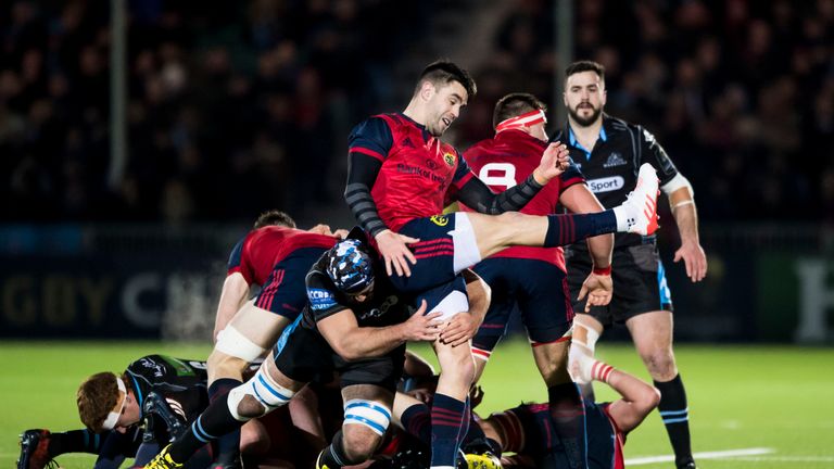 Munster's Conor Murray (right) is tackled by Josh Strauss of Glasgow Warriors