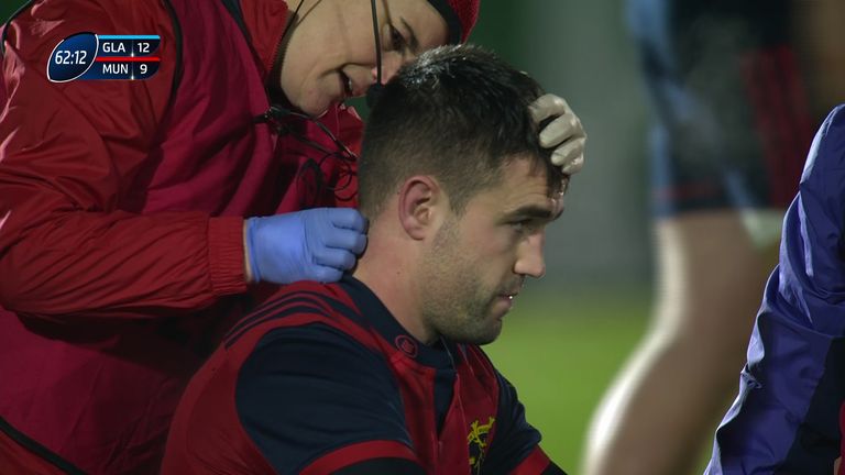 Conor Murray receives attention from Munster's medical staff after his collision with Glasgow's Tim Swinson