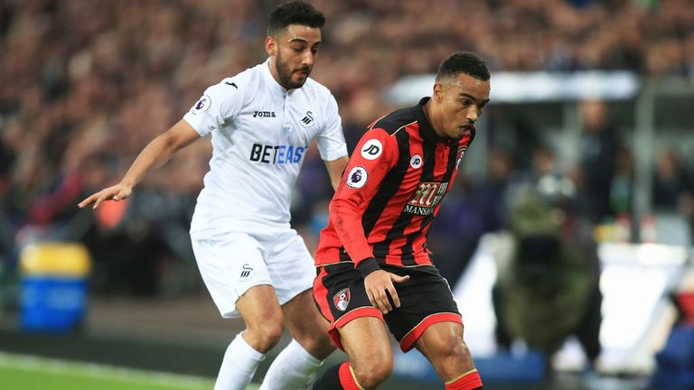 Swansea's Neil Taylor (L) in action against Bournemouth