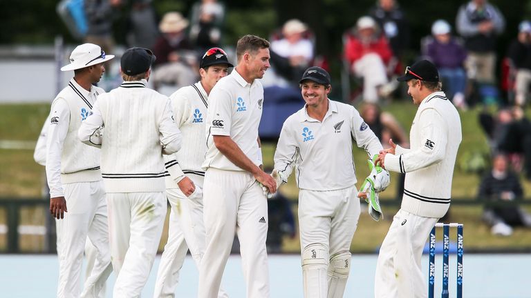 Tim Southee (centre) of New Zealand is congratulated by team mates after taking five wickets against Bangladesh