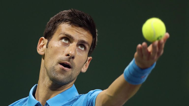 Serbia's Novak Djokovic serves the ball to Jan-Lennard Struff of Germany, during the ATP Qatar Open tennis competition in Doha on January 2, 2017.  / AFP /