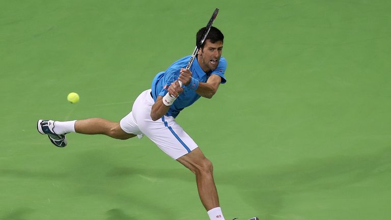 Serbia's Novak Djokovic returns the ball to Spain's Fernando Verdasco during their semi-final tennis match of the ATP Qatar Open in Doha on January 6, 2017