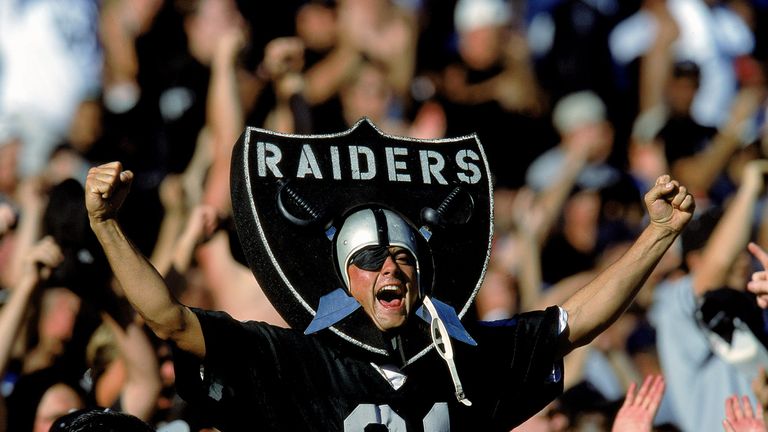 24 Oct 1999: A fan of the Oakland Raiders cheers in the stands as he wears the logo during a game against the New York Jets at the Network Coliseum in Oakl