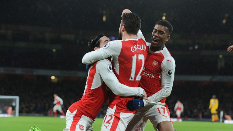 Olivier Giroud celebrates with Alex Iwobi (right) and Hector Bellerin after scoring against Crystal Palace