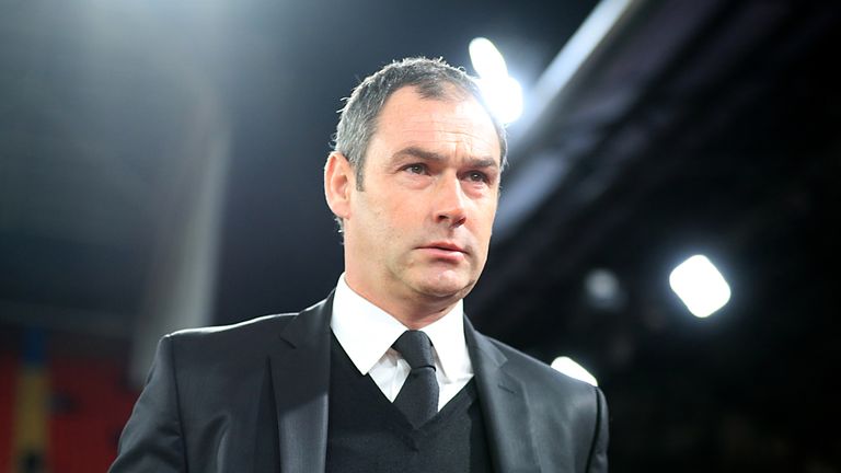 Swansea City Manager Paul Clement heads out onto the pitch
