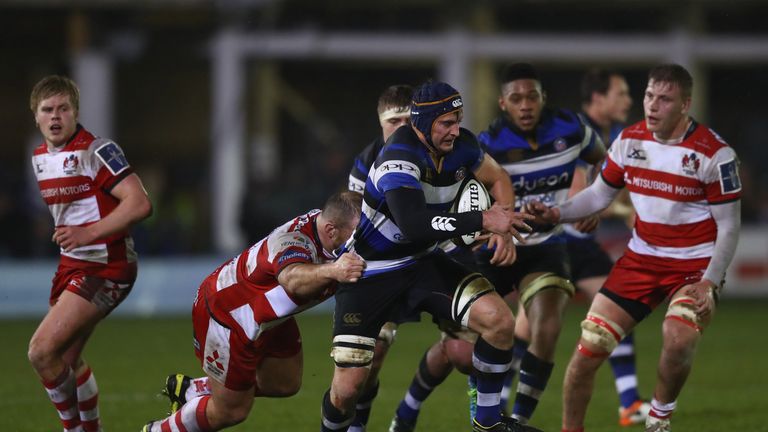 BATH - JANUARY 27 2017:  Paul Grant of Bath is tackled by Yann Thomas (L) of Gloucester during the Anglo Welsh Cup match between Bath and Gloucester