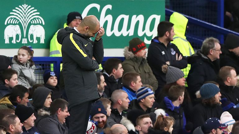 Pep Guardiola appears dejected on the touchline with his team 2-0 down