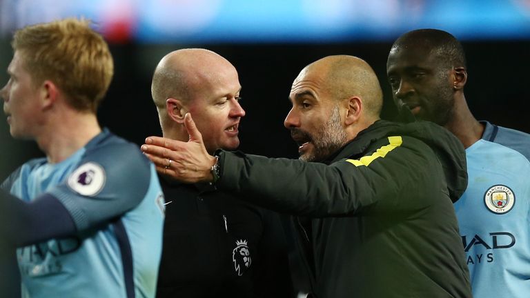 MANCHESTER, ENGLAND - JANUARY 02: Referee Lee Mason aruges with Josep Guardiola, Manager of Manchester City after the Premier League match between Manchest
