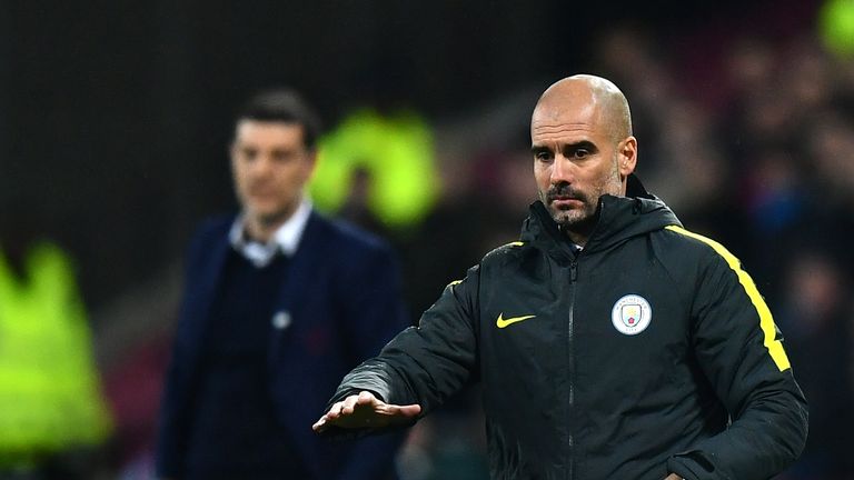 LONDON, ENGLAND - JANUARY 06:  Josep Guardiola, Manager of Manchester City throws the ball back into play during The Emirates FA Cup Third Round match betw