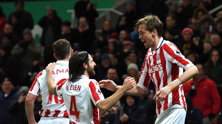 STOKE ON TRENT, ENGLAND - JANUARY 03:  Peter Crouch of Stoke City celebrates scoring his team's second goal with his team mate Joe Allen during the Premier